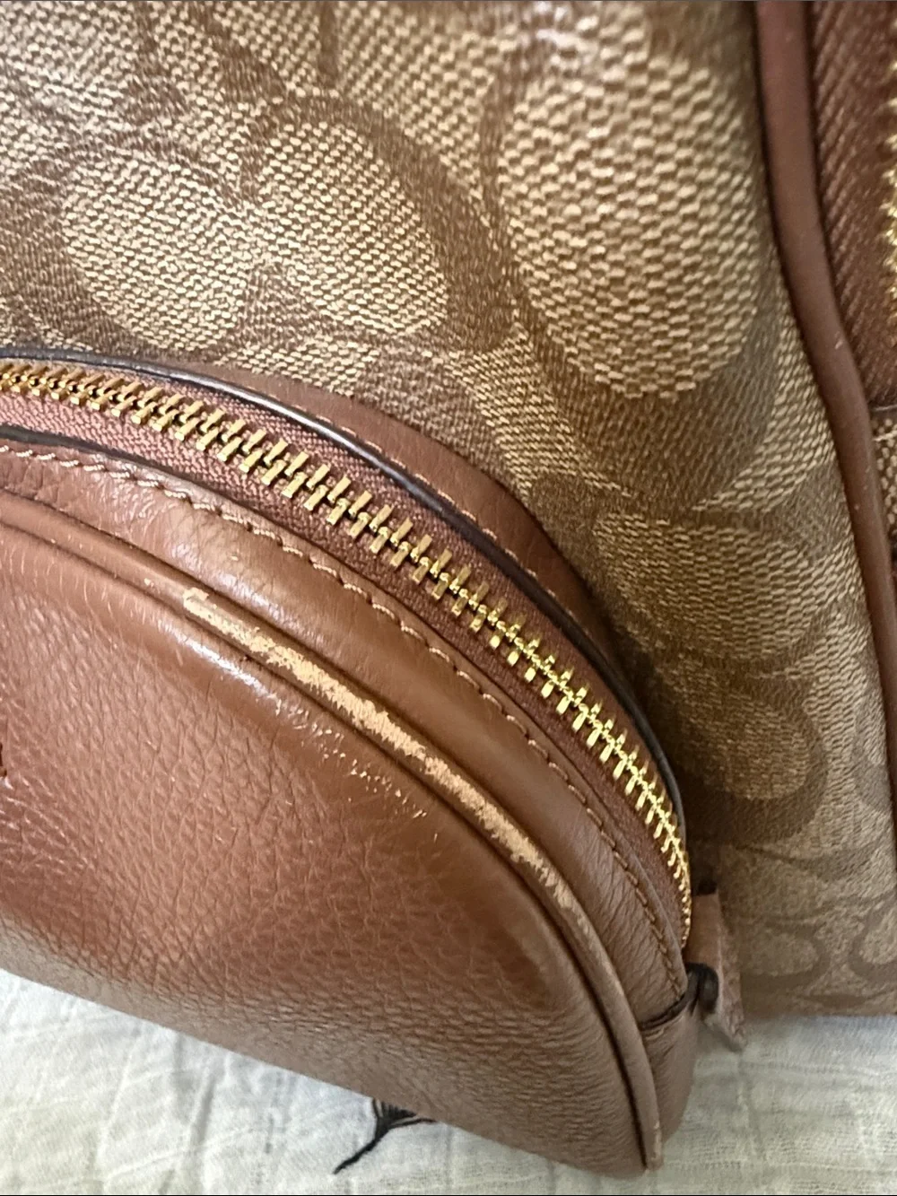 Coach Brown Signature Leather Backpack with gold hardware